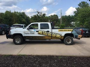roofing company work truck with vinyl wrap